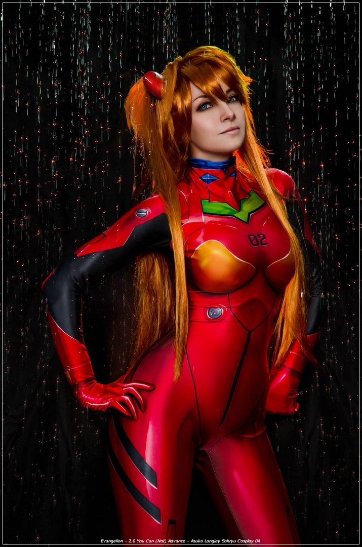 A person in a red and black bodysuit resembling a popular anime character, standing confidently with a dynamic pose. The background features a cascade of shimmering lights.