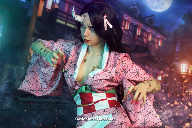 A character in a pink kimono with geometric patterns, featuring horns and colorful nails, poses dramatically against a nighttime background with traditional Japanese architecture and a full moon.