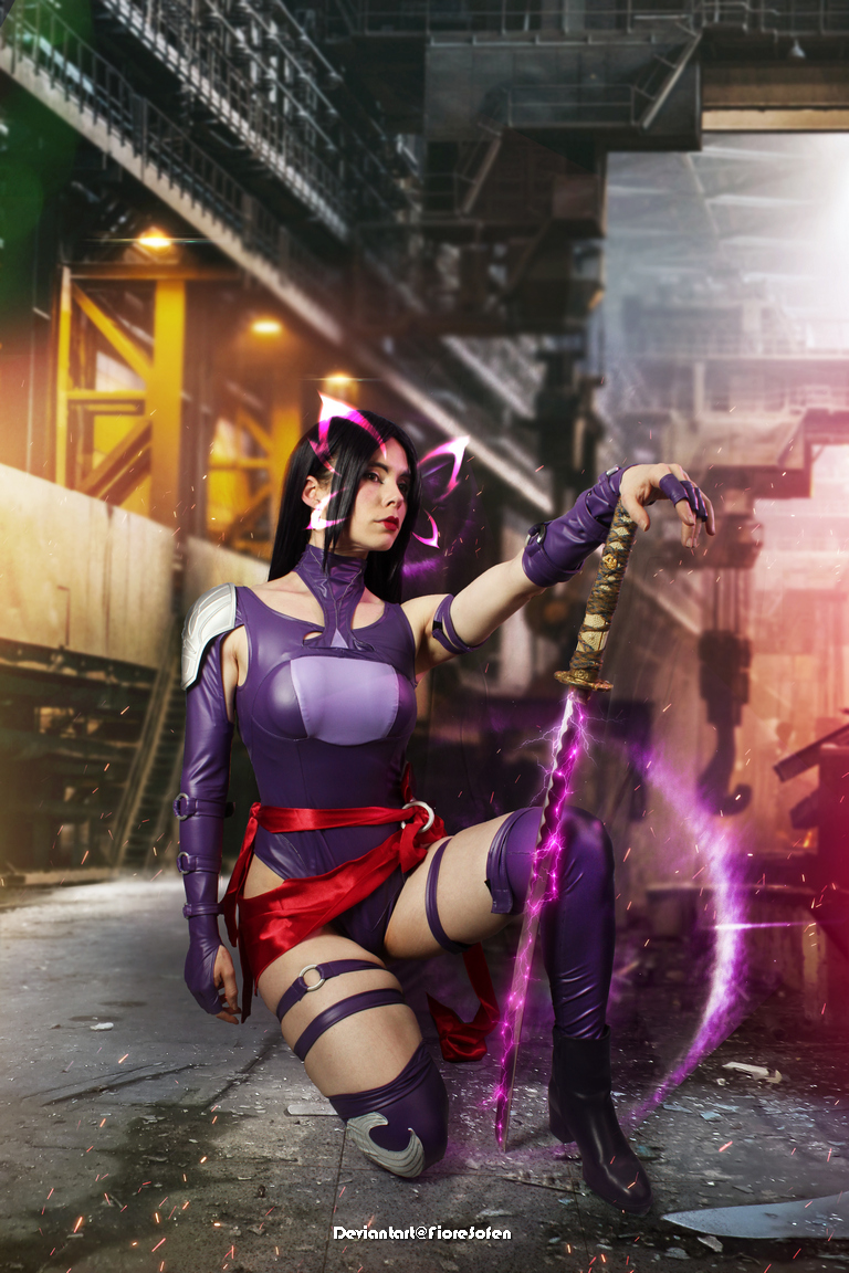 A female cosplayer in a purple outfit, holding a sword with a glowing purple effect, is posing in an industrial setting.