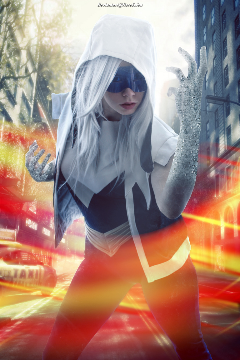 A superhero character with silver hair and a white costume, striking a powerful pose in an urban setting. The background features blurred lights and a cityscape, enhancing the dynamic action feel.