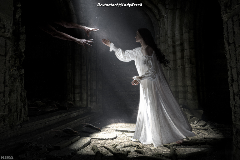 A woman in a white dress reaching out towards ghostly hands in a dark, eerie setting.