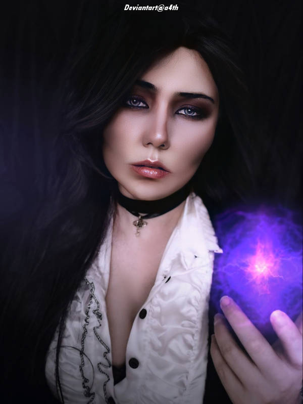 A close-up portrait of a person with dark hair, wearing a white shirt and black choker, holding a glowing purple orb in one hand with a mystical expression.