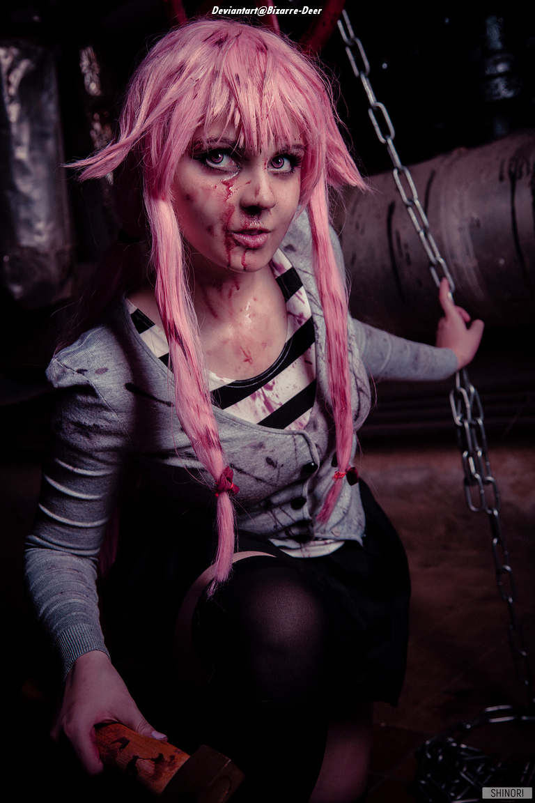 A character with pink hair and chains, wearing a blood-stained outfit, poses dramatically in a dimly lit environment.