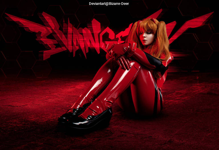 A character in a red latex suit with orange hair sits curled up on a red background, with the word 'VINGE' in stylized text behind them.