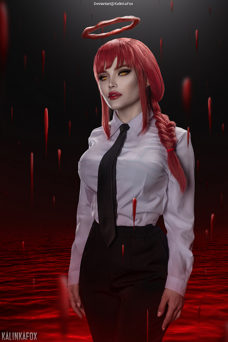 A woman with red hair and yellow eyes stands in a dark environment, wearing a white shirt and black tie, with a halo above her head and red liquid dripping around her.