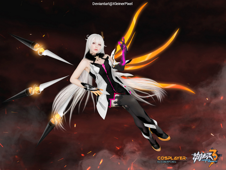 A female cosplayer dressed in a character outfit with white hair and dynamic wing-like extensions, posed dramatically against a dark, smoky background.