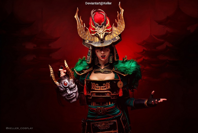 A person wearing an elaborate warrior costume with a dramatic headdress, holding a mask, against a red background with traditional Asian architectural elements.
