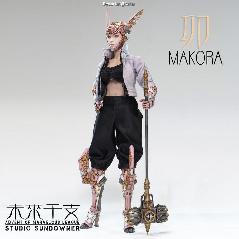 A character figure named Makora, wearing a stylish outfit with a cropped jacket and baggy pants. She has decorative armor on her legs and holds a staff. The background is simple and light-colored.
