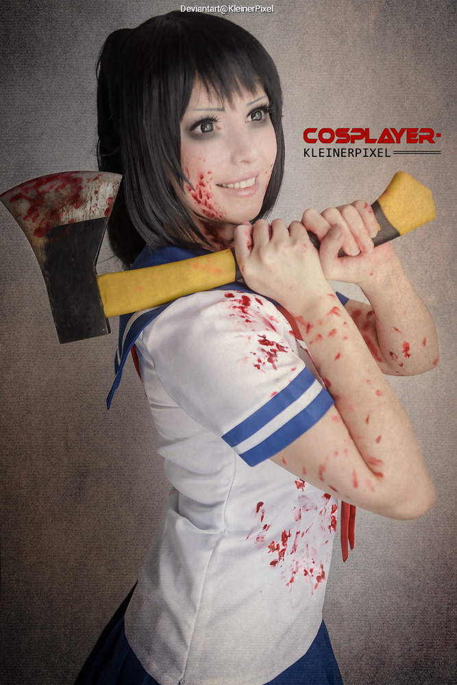 A cosplayer wearing a blood-spattered school uniform, holding a large axe and smiling at the camera.