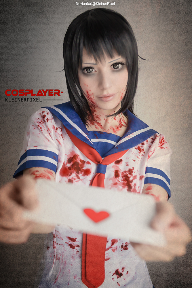 A cosplayer in a blood-splattered school uniform holds out a white envelope with a red heart, showcasing a dramatic and artistic interpretation.