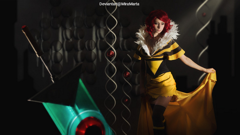 A person wearing a costume with a yellow and black design and a feathered collar, posing in a stylized environment with abstract shapes and lighting.