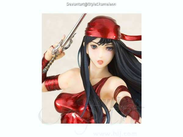 Close-up of a female action figure wearing a red outfit, holding a sword, and featuring long black hair.