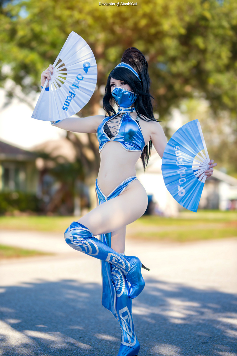 A person in a blue costume holding two fans features the text 'OnlyFans'. The individual is posing outdoors in a playful stance.