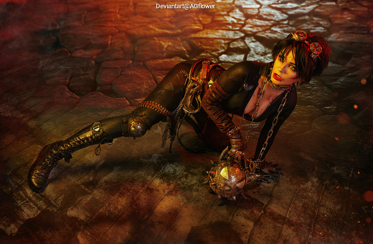 A character in a dark, atmospheric environment, wearing a black outfit with chains and a spiked ball, positioned on a rocky surface, displaying an intense expression.