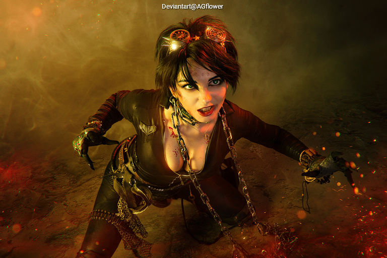 A fierce character crouching on the ground, wearing dark clothing and goggles. They have chains around their waist and arm, with dramatic lighting creating a dynamic atmosphere.