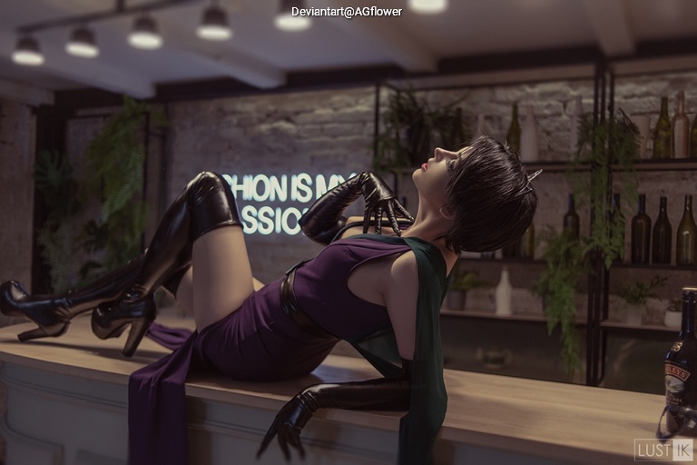 A stylish figure in a purple dress and black thigh-high boots lounges on a bar counter, surrounded by decorative bottles and greenery.