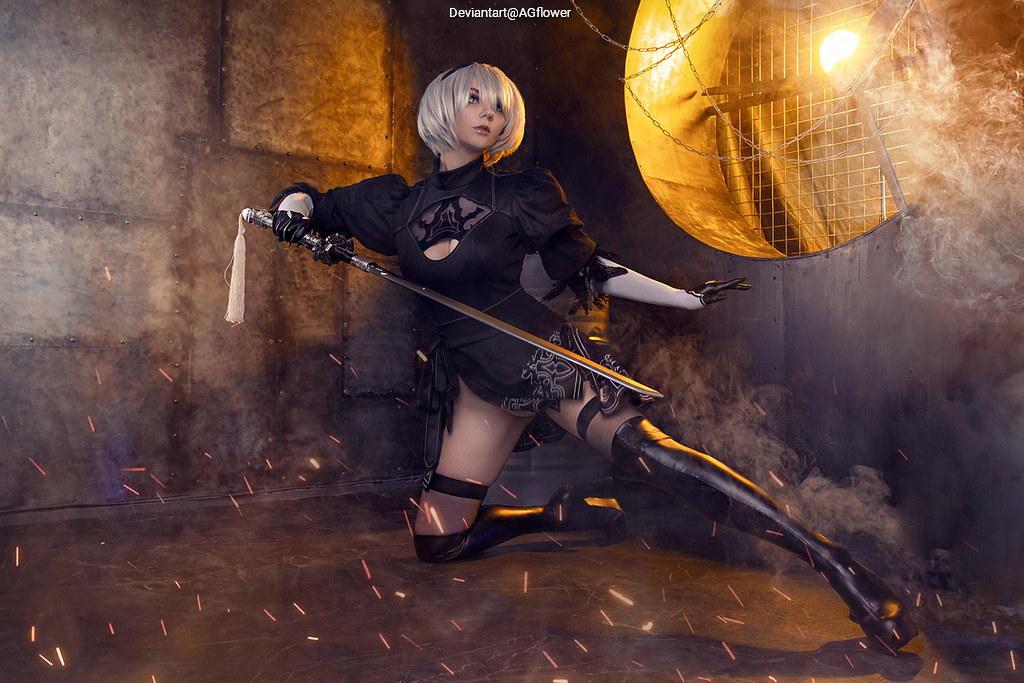 A person in a dynamic pose, dressed in a black outfit with a high slit, holding a katana sword. The background features a metallic wall and dramatic lighting, with sparks and smoke enhancing the action-oriented aesthetic.