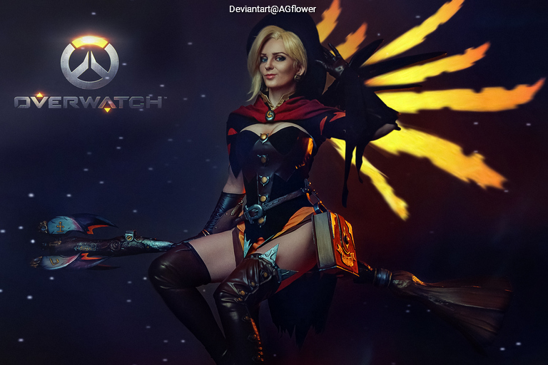 A character from Overwatch dressed as a witch, sitting on a broom, with a magical staff and a dramatic background featuring flames.