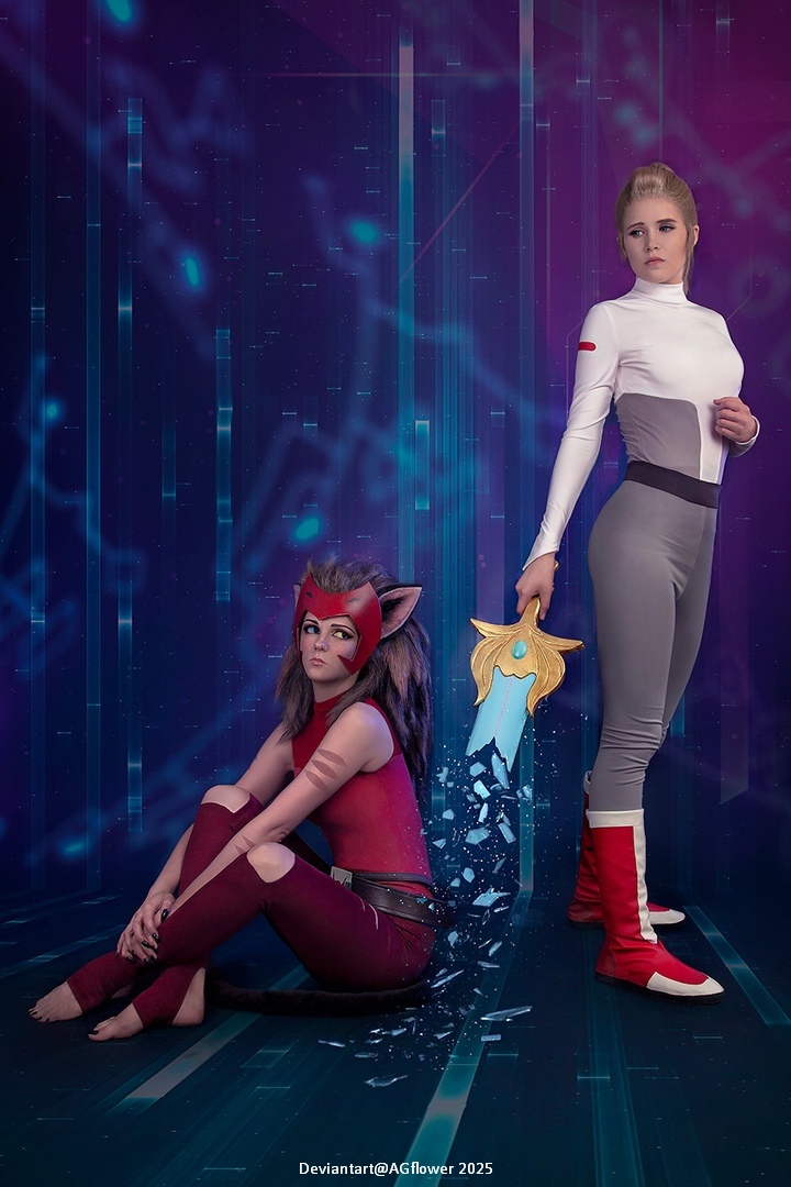 Two cosplayers posing against a colorful digital background. The character on the left has dark hair and feline features, wearing a red and black costume. The character on the right is dressed in a futuristic gray and white outfit, holding a decorative sword.